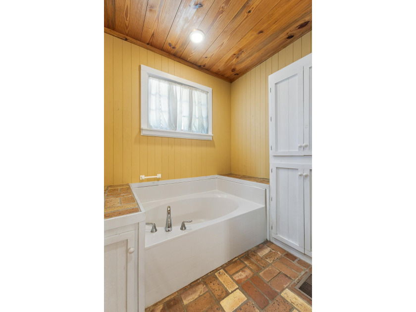Hidden beneath towering hardwoods on a private wooded setting - photo 25