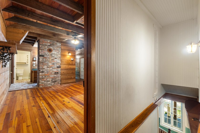 Hidden beneath towering hardwoods on a private wooded setting - photo 28