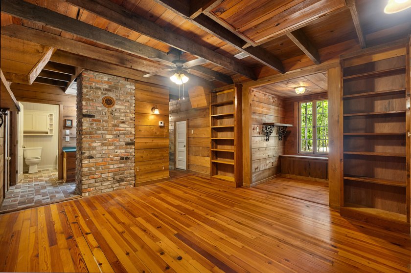 Hidden beneath towering hardwoods on a private wooded setting - photo 29