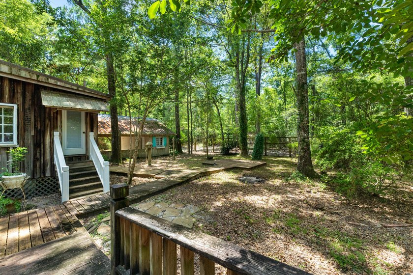 Hidden beneath towering hardwoods on a private wooded setting - photo 36