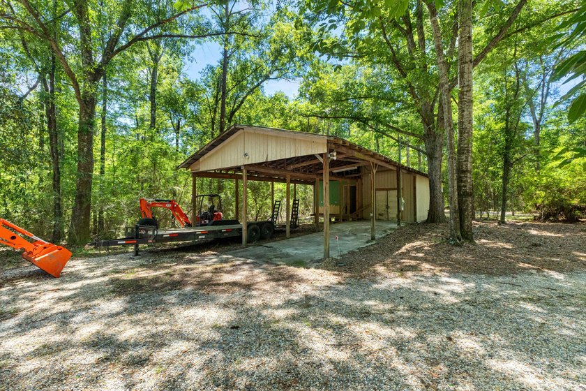 Hidden beneath towering hardwoods on a private wooded setting - photo 46