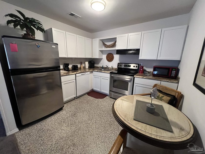 Incredible downstairs CONDO is ideally located in the heart of - photo 8