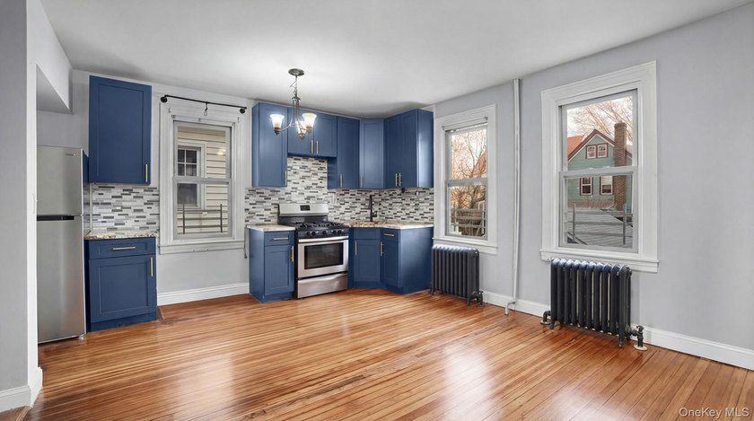 Presenting a beautifully renovated four-level, two-family - photo 4