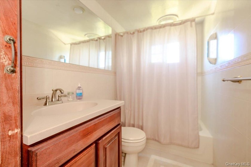 Classic Cape Cod charm meets exceptional versatility in this - photo 14