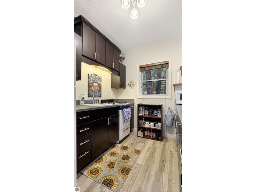 This two-bedroom, one-bath home is located across the street - photo 11