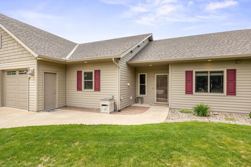 This stately patio home built by Larson Builders overlooks the - photo 2