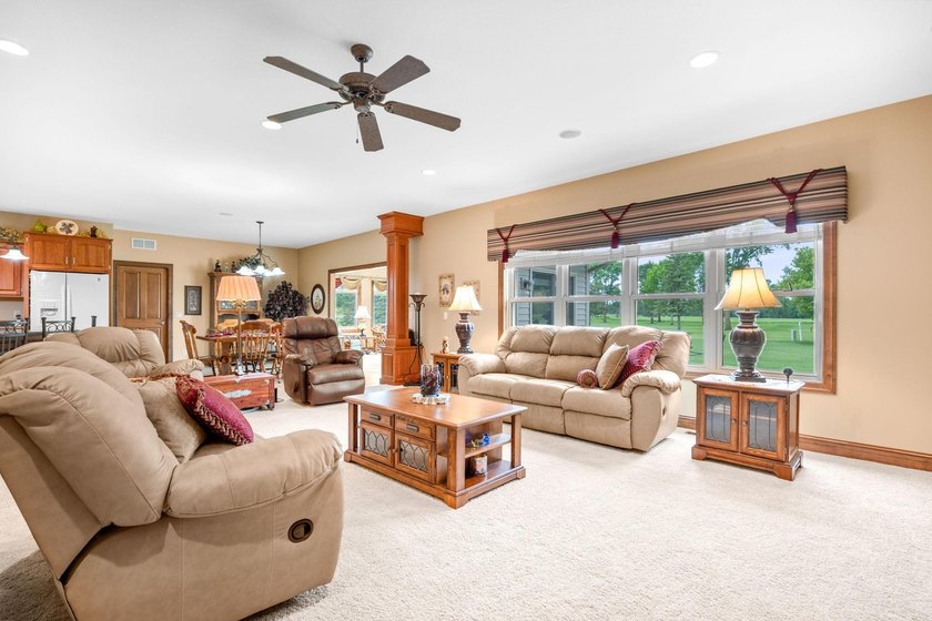 This stately patio home built by Larson Builders overlooks the - photo 7
