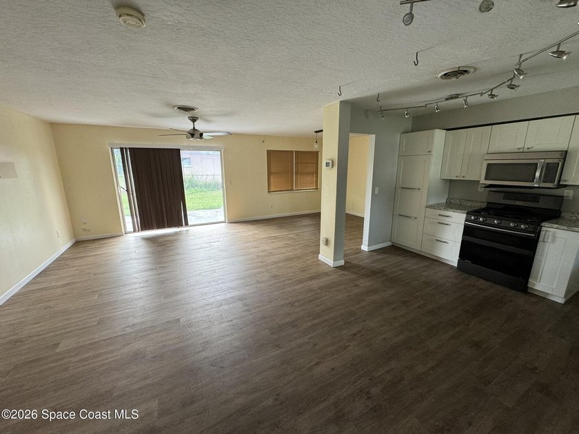 No HOA! Enjoy a light and bright interior with a fully fenced - photo 6