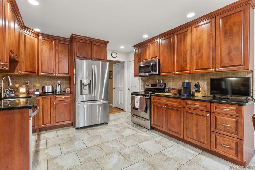 Welcome to this beautiful expanded ranch located in the - photo 5