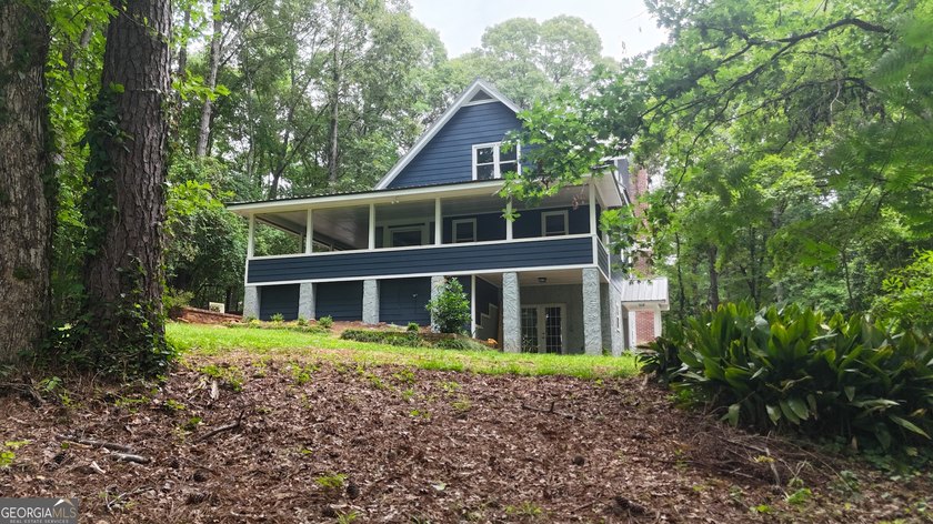 Welcome to a truly one-of-a-kind waterfront retreat where rustic - photo 5