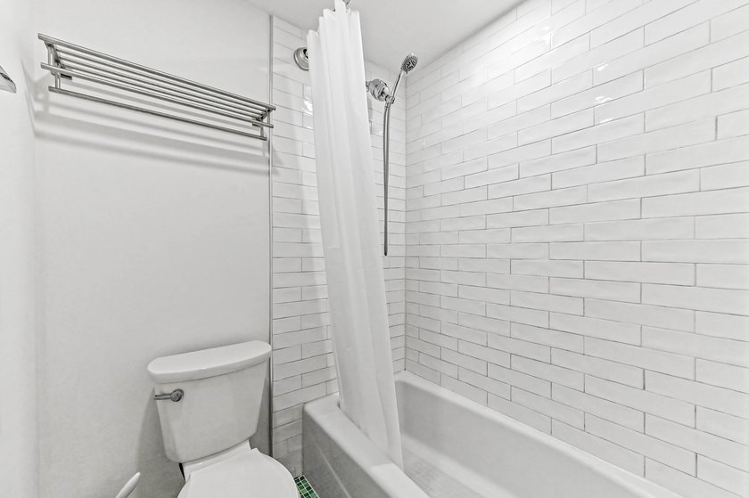 Stylishly updated 2-bedroom, 1.5-bathroom corner unit in the - photo 26
