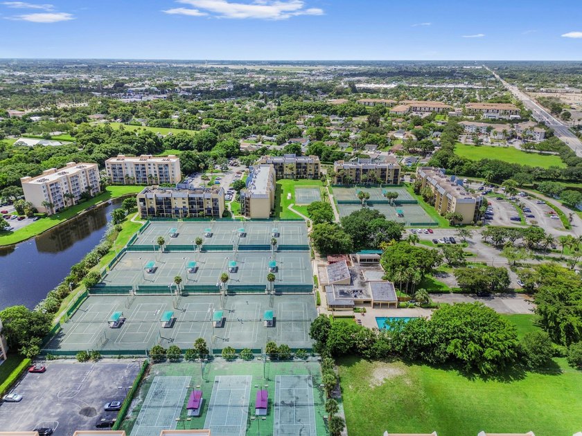 Stylishly updated 2-bedroom, 1.5-bathroom corner unit in the - photo 37
