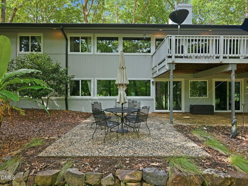 Set on two lots totaling 1.3 acres with panoramic views of the - photo 2