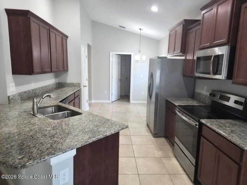 Welcome to this charming, 4-bedroom, 2-bathroom home nestled in - photo 3