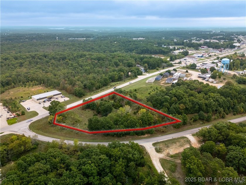 Nearly 2 acres of undeveloped land perfectly positioned on the - photo 3