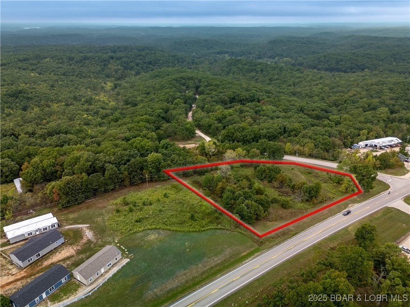 Nearly 2 acres of undeveloped land perfectly positioned on the - photo 7