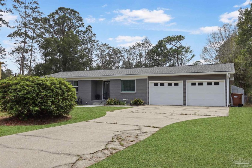 Set along 99 feet of watererfront, this updated brick home - photo 8