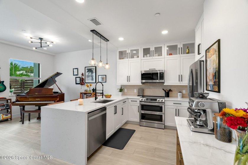 Built in 2024, this stunning end-unit townhome offers the - photo 3