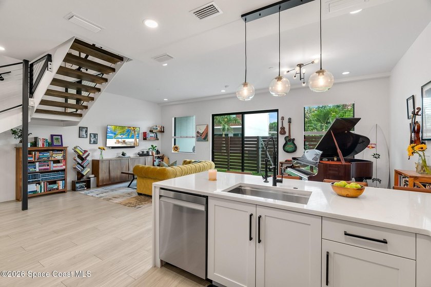 Built in 2024, this stunning end-unit townhome offers the - photo 5