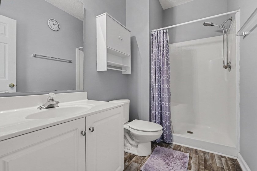 This updated second-floor, 3-bedroom, 2-bath condo overlooks the - photo 13