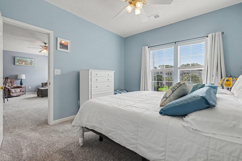 This updated second-floor, 3-bedroom, 2-bath condo overlooks the - photo 19