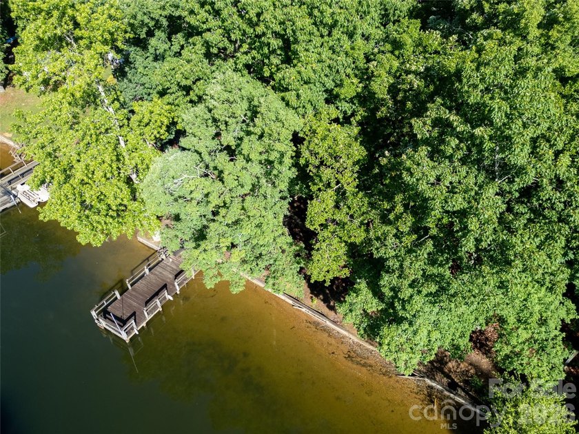 Tucked away along the peaceful shores of Badin Lake, this - photo 4