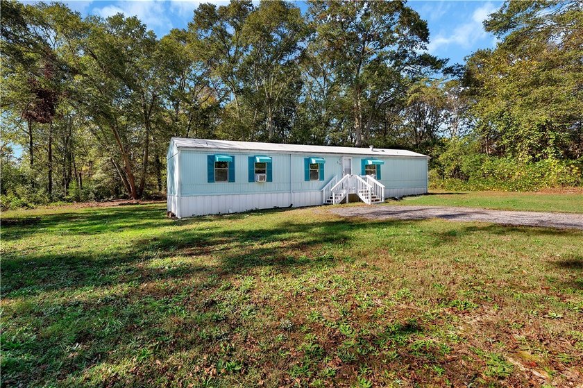 Single Wide Mobile home located on a 1.28-acre level lot. Brand - photo 2