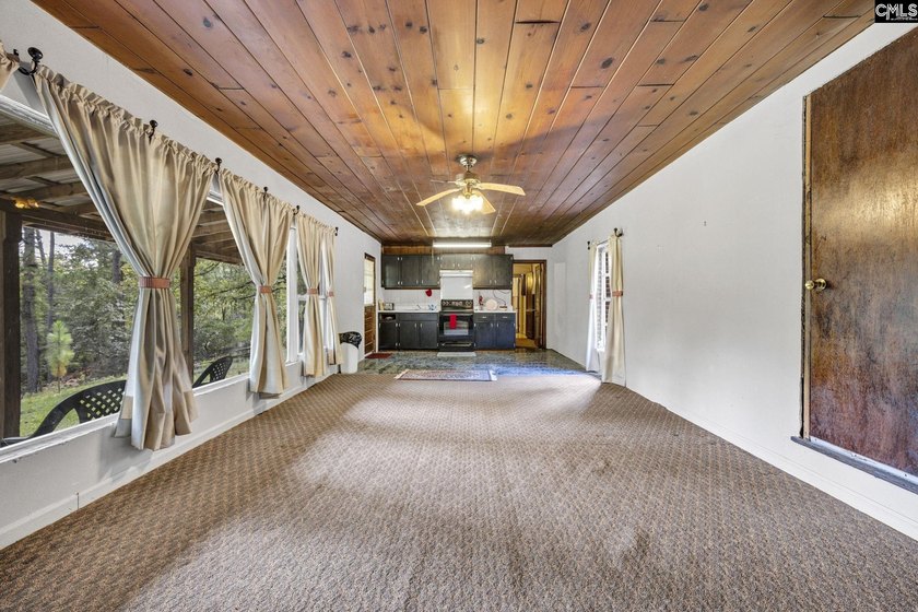 A long, private, tree-lined drive leads to a brick cabin - photo 17