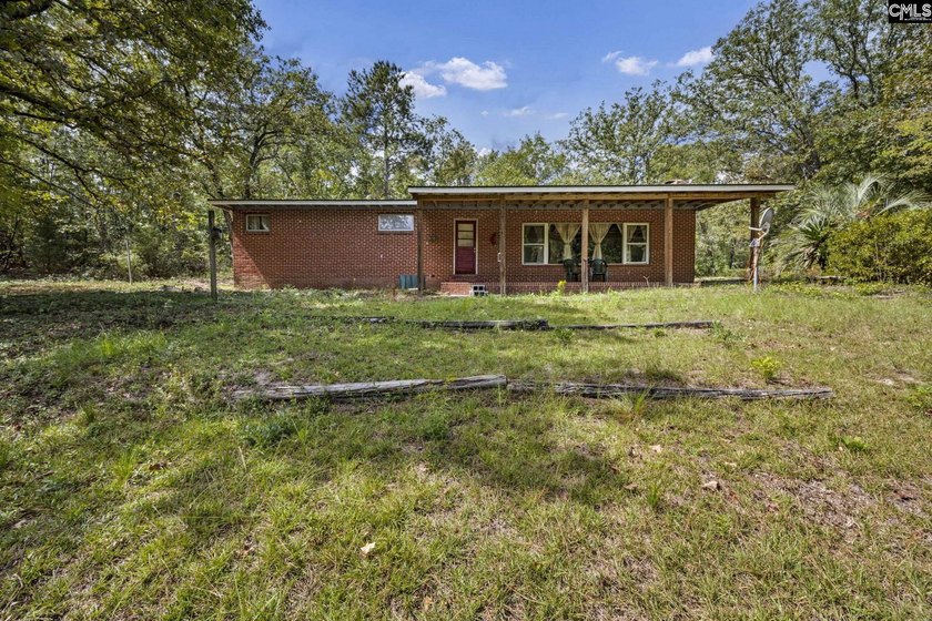 A long, private, tree-lined drive leads to a brick cabin - photo 27