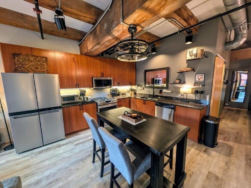 This beautifully maintained, open-concept condo/loft at River - photo 2