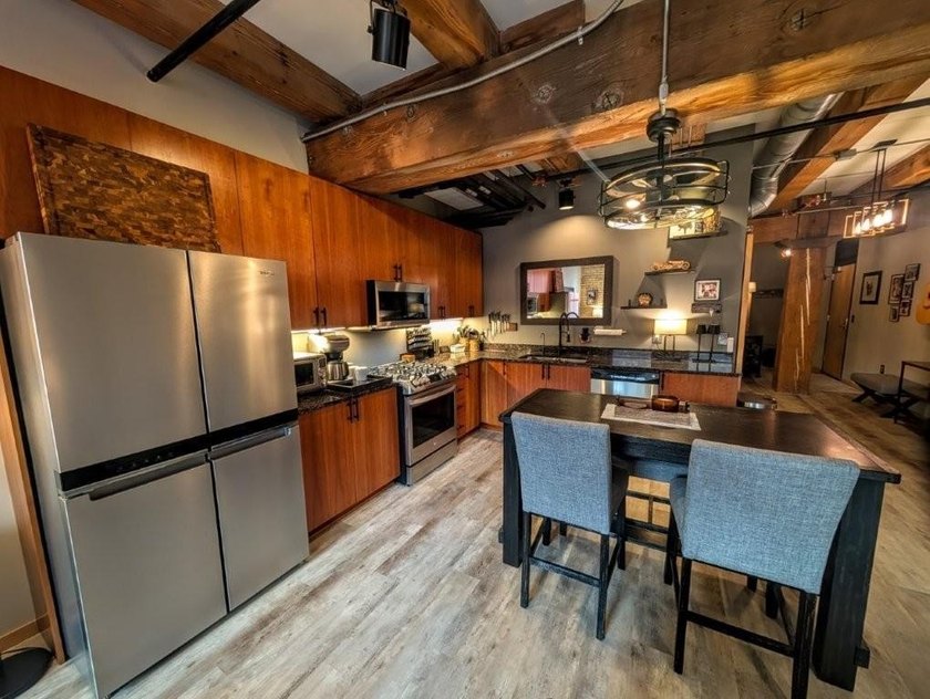 This beautifully maintained, open-concept condo/loft at River - photo 4