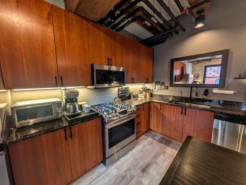 This beautifully maintained, open-concept condo/loft at River - photo 5