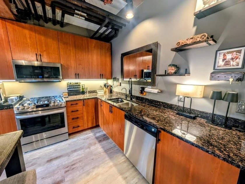 This beautifully maintained, open-concept condo/loft at River - photo 6