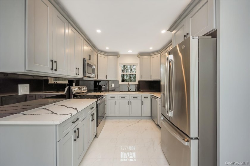 Welcome to this beautifully renovated 4-bedroom, 2.5-bath home - photo 9