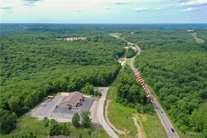 This expansive 5-acre commercial lot boasts exceptional frontage - photo 2
