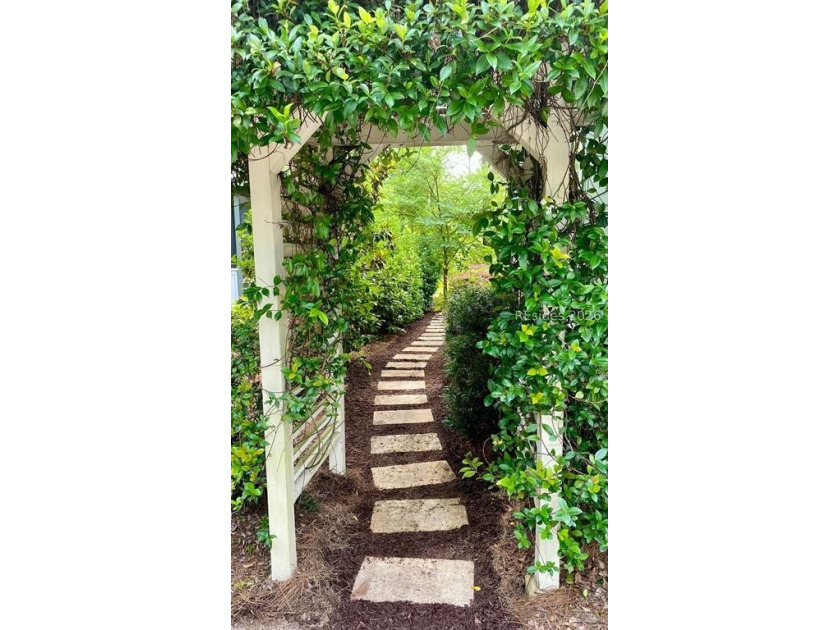 Tucked into a serene waterfront setting where towering trees - photo 42