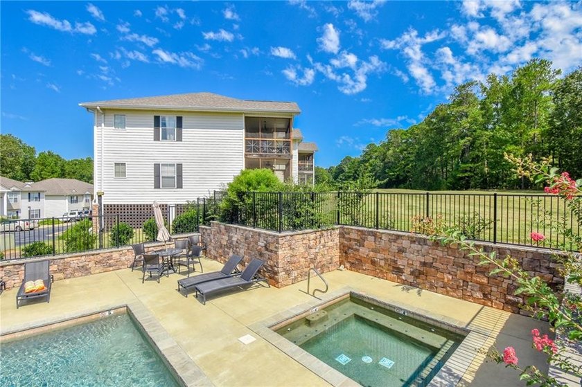 This inviting 2 bedroom, 2 bath condo is located inside the - photo 3