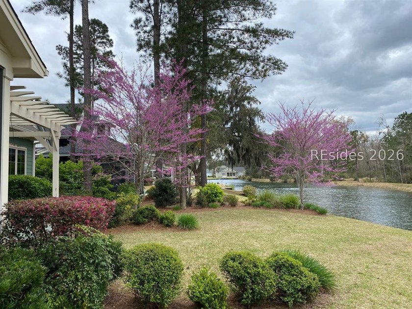 Tucked into a serene waterfront setting where towering trees - photo 47