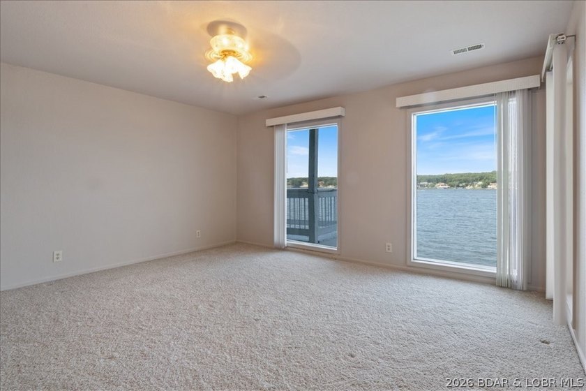 Perched above the shimmering waters of the Lake of the Ozarks - photo 34