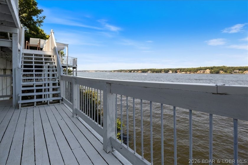 Perched above the shimmering waters of the Lake of the Ozarks - photo 42