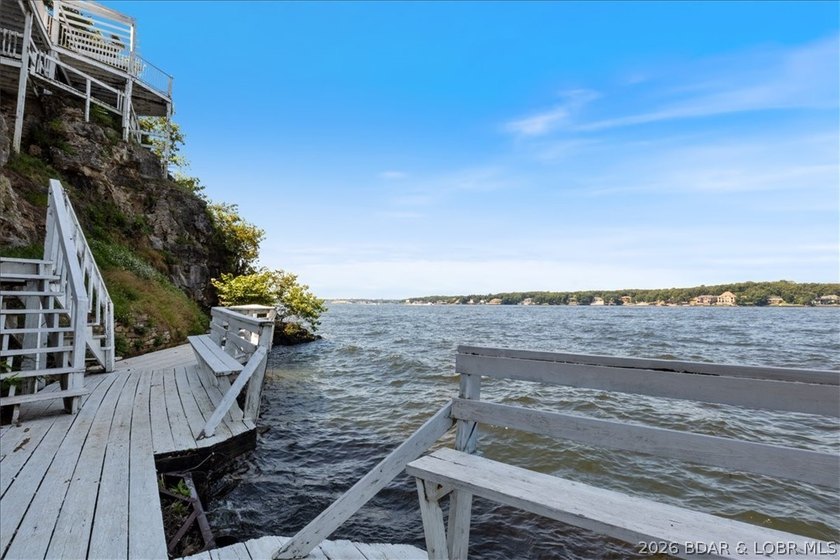 Perched above the shimmering waters of the Lake of the Ozarks - photo 43