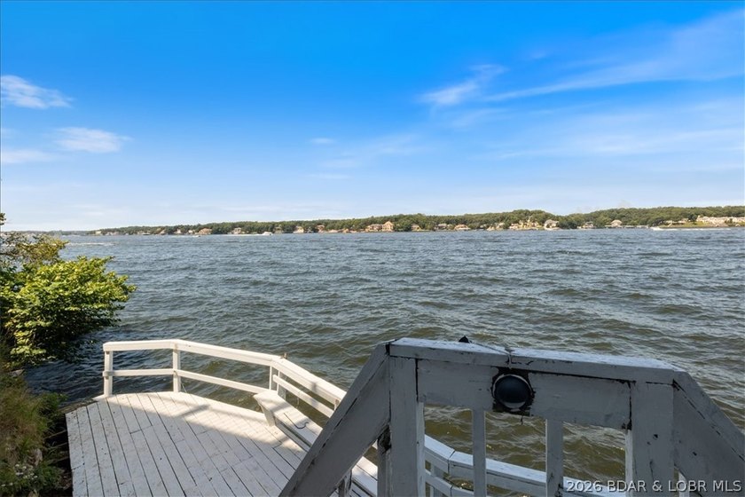 Perched above the shimmering waters of the Lake of the Ozarks - photo 44