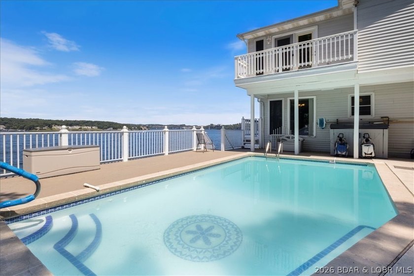 Perched above the shimmering waters of the Lake of the Ozarks - photo 47