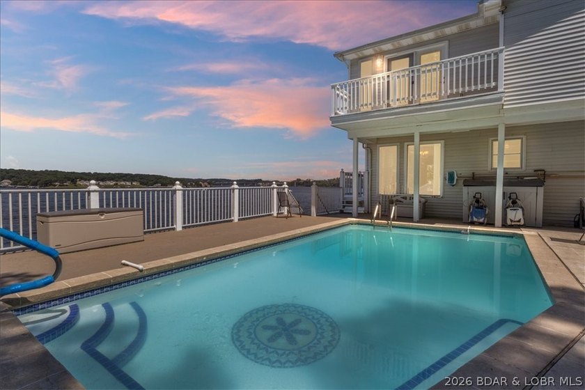Perched above the shimmering waters of the Lake of the Ozarks - photo 48