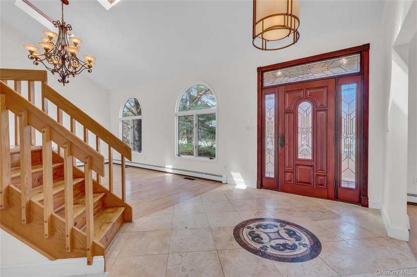 Set on nearly an acre in the heart of Miller Place, this - photo 3