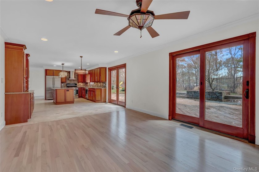Set on nearly an acre in the heart of Miller Place, this - photo 9