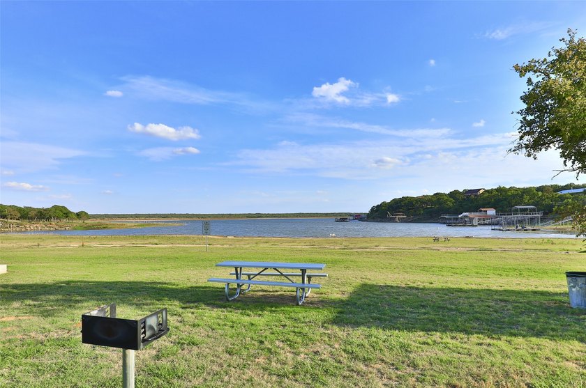 Beautiful tree covered half-acre lake lot ready for you to build - photo 11