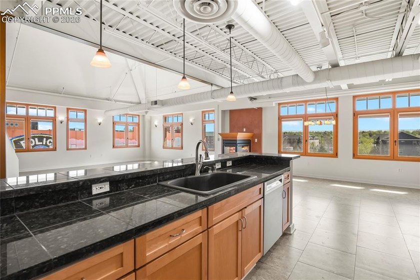 This rare penthouse corner residence in Poet Lofts, offers an - photo 11