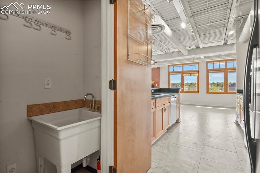 This rare penthouse corner residence in Poet Lofts, offers an - photo 15