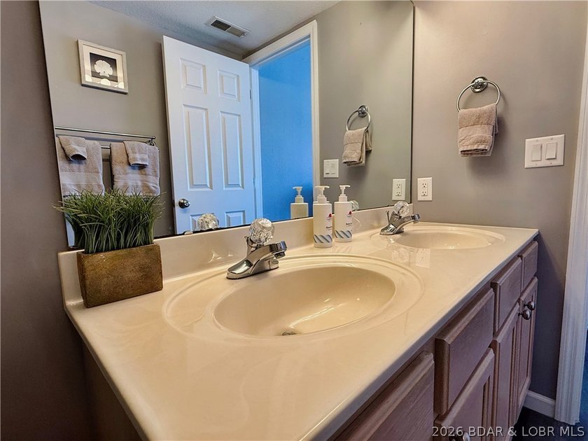 Lake life just got a serious glow-up! This beautifully remodeled - photo 30